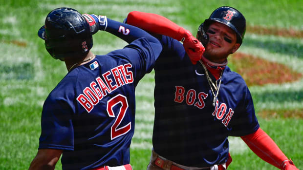 Boston Red Sox center fielder Alex Verdugo (99) celebrates with shortstop Xander Bogaerts (2) after hitting a three-run home run against the Baltimore Orioles at Oriole Park at Camden Yards.